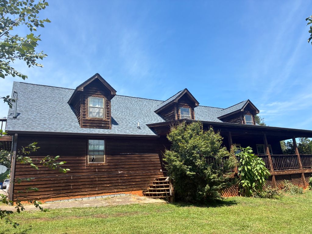 After: the same home with a brand new gray architectural shingle roof