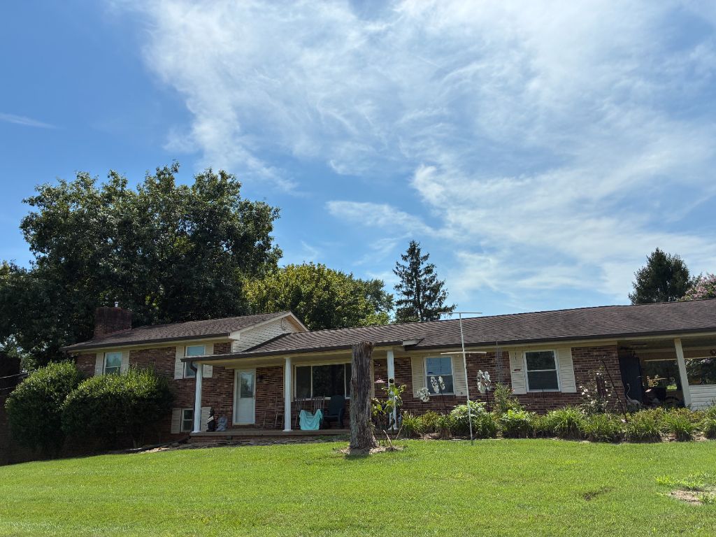 Before: brick ranch home with worn, faded 3-tab asphalt shingles