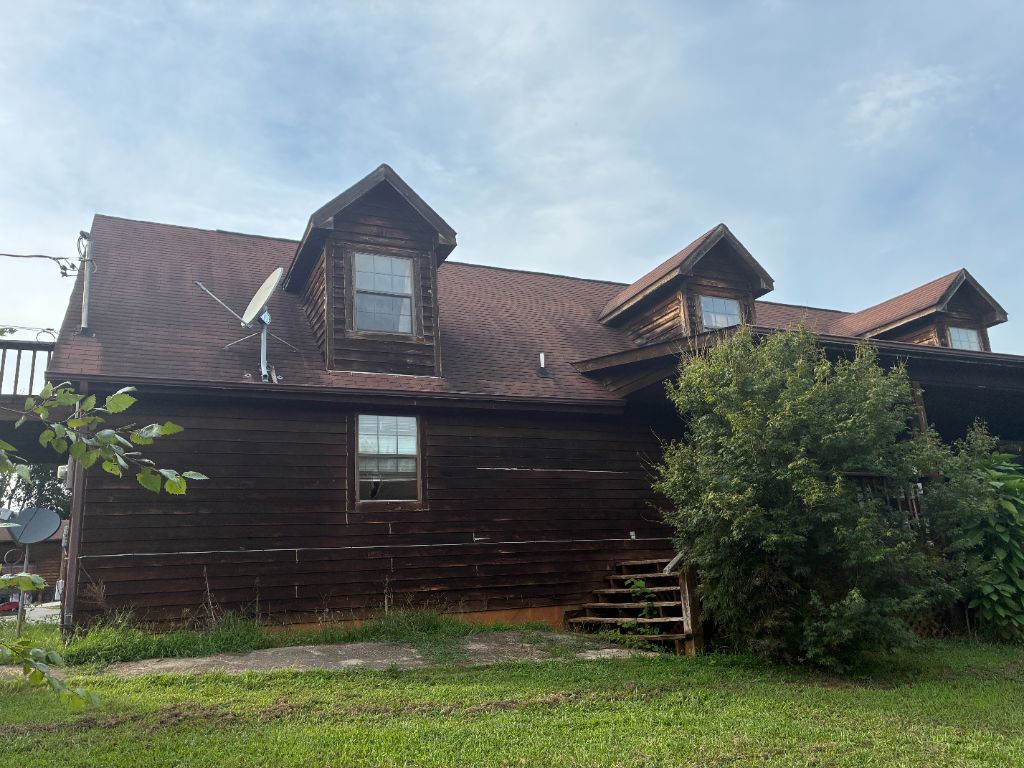 Before: log-style home with an aging, worn shingle roof near Seymour, TN